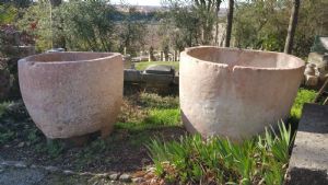 Half-moon marble tubs used as oil containers